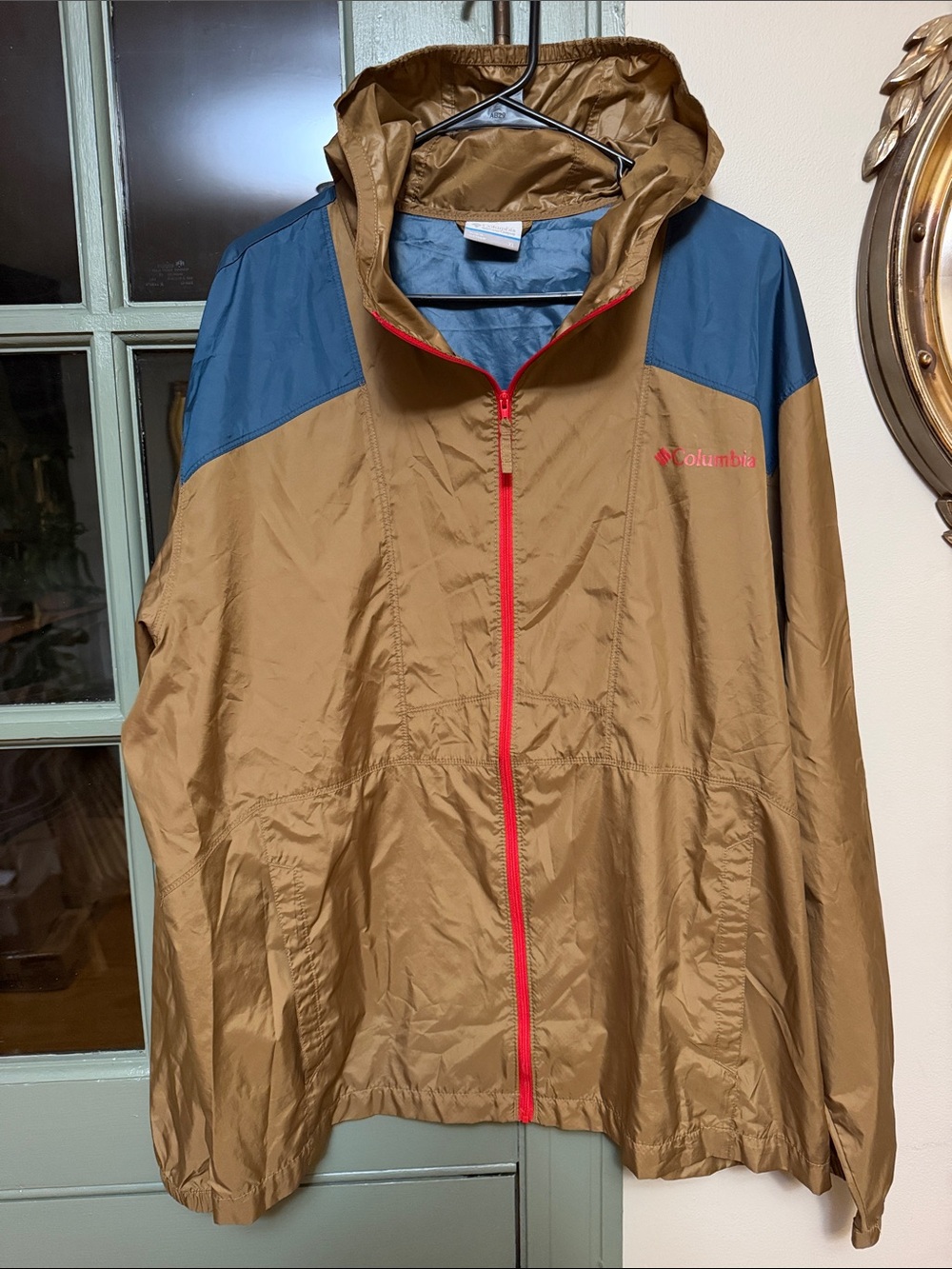Columbia Brown Hooded Raincoat with Blue Shoulder Panels and Red Zipper